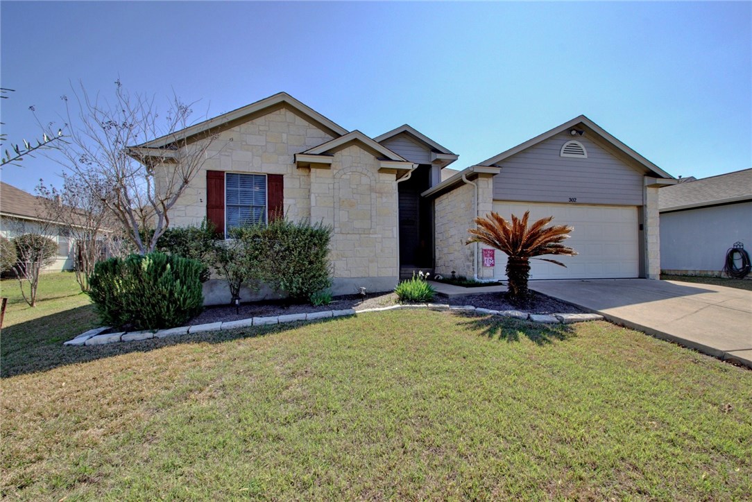 302 Little Lake Road Hutto, TX 78634 - Photo 1 of 1 a front view of house with yard and seating area