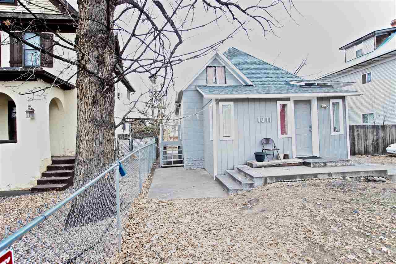 1011 Rood Avenue, Unit C Grand Junction, CO 81501 - Photo 2 of 8 a front view of a house with a yard