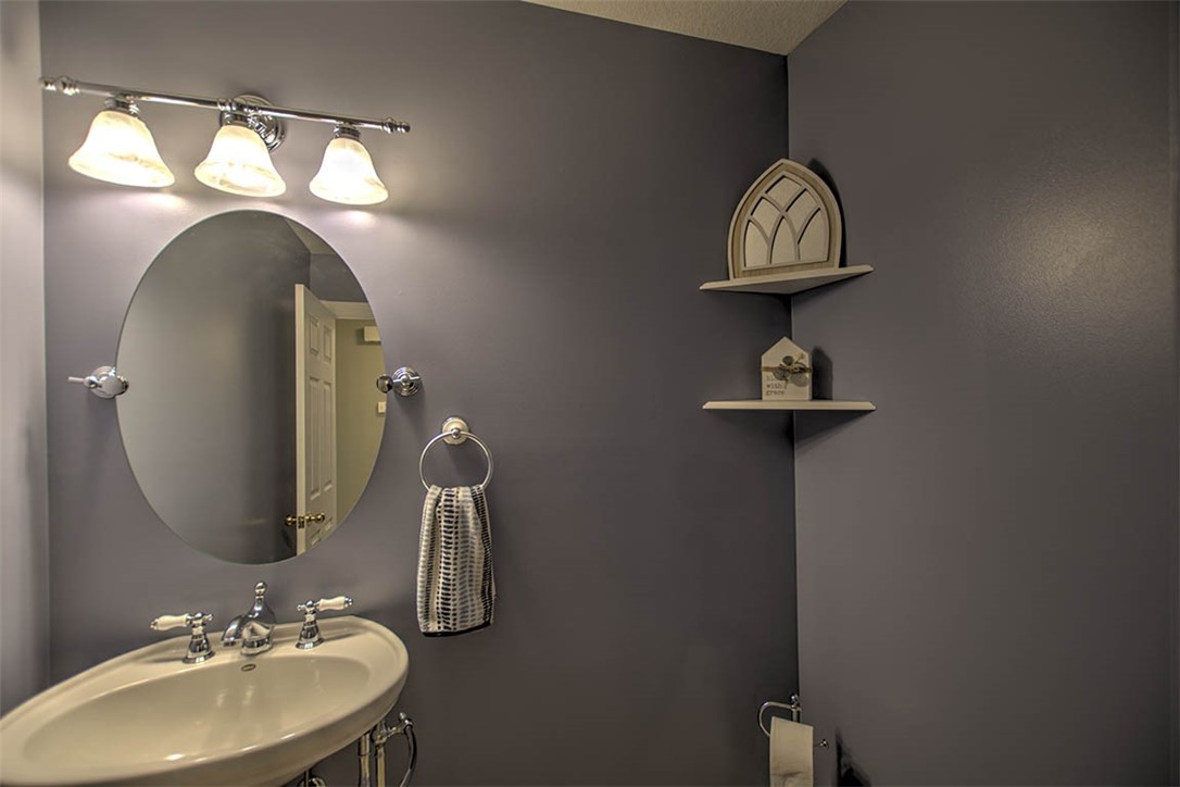 6750 Camp Warren Road Decatur, IL 62521 - Photo 22 of 34 a bathroom with a sink and a mirror