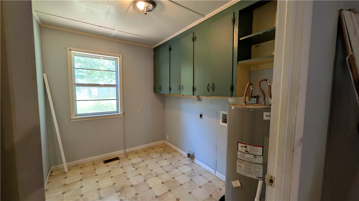 194 Pine Valley Loop Houston, AR 72070 - Photo 10 of 21 Utility room featuring a window, patterned vinyl flooring, built-in upper cabinetry, and dedicated appliance hookups