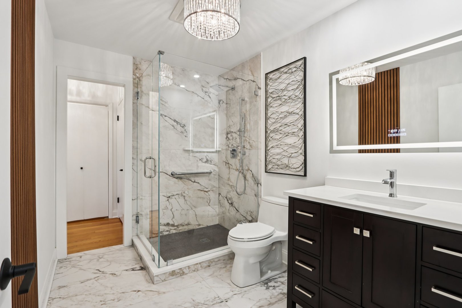 2019 East Avon Lane Arlington Heights, IL 60004 - Photo 35 of 59 a spacious bathroom with a toilet sink shower and a mirror