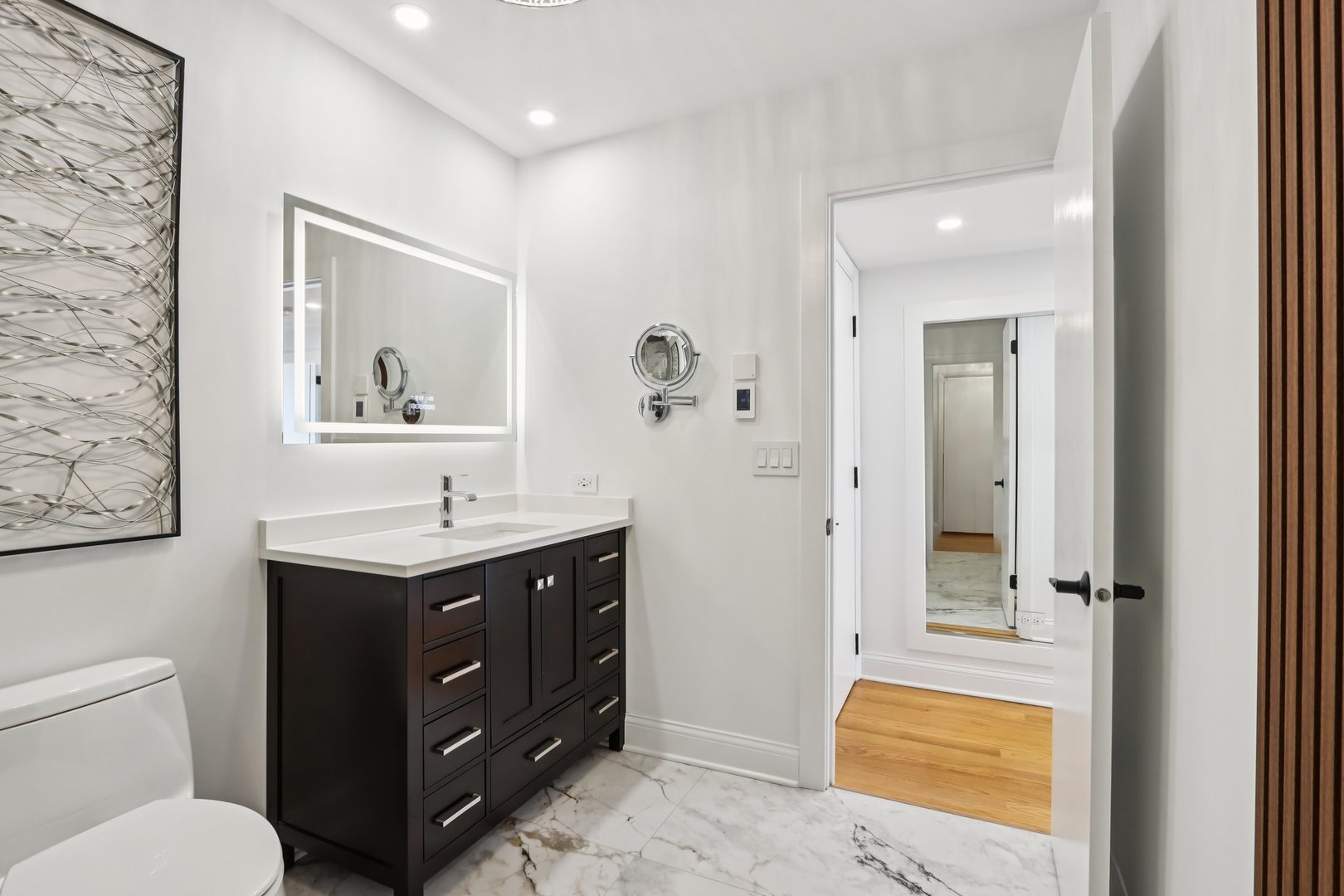 2019 East Avon Lane Arlington Heights, IL 60004 - Photo 36 of 59 a bathroom with a toilet a sink and mirror