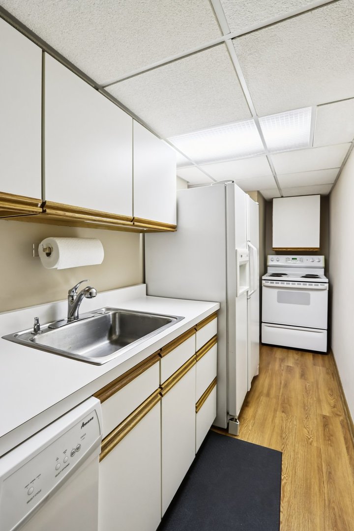 2019 East Avon Lane Arlington Heights, IL 60004 - Photo 43 of 59 a kitchen with refrigerator and cabinets