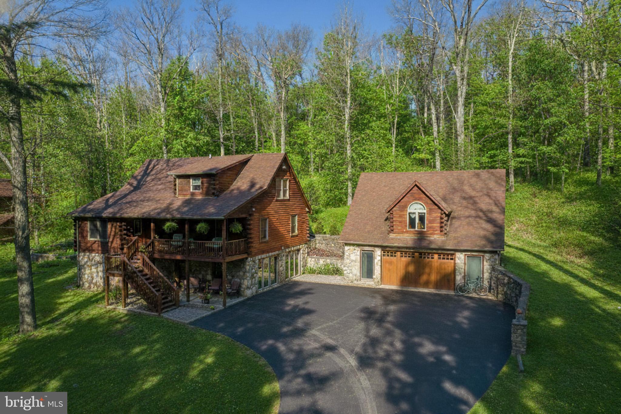 542 Bench Road Swanton, MD 21561 - Photo 2 of 60 Oversized stacked stone garage with guest suite