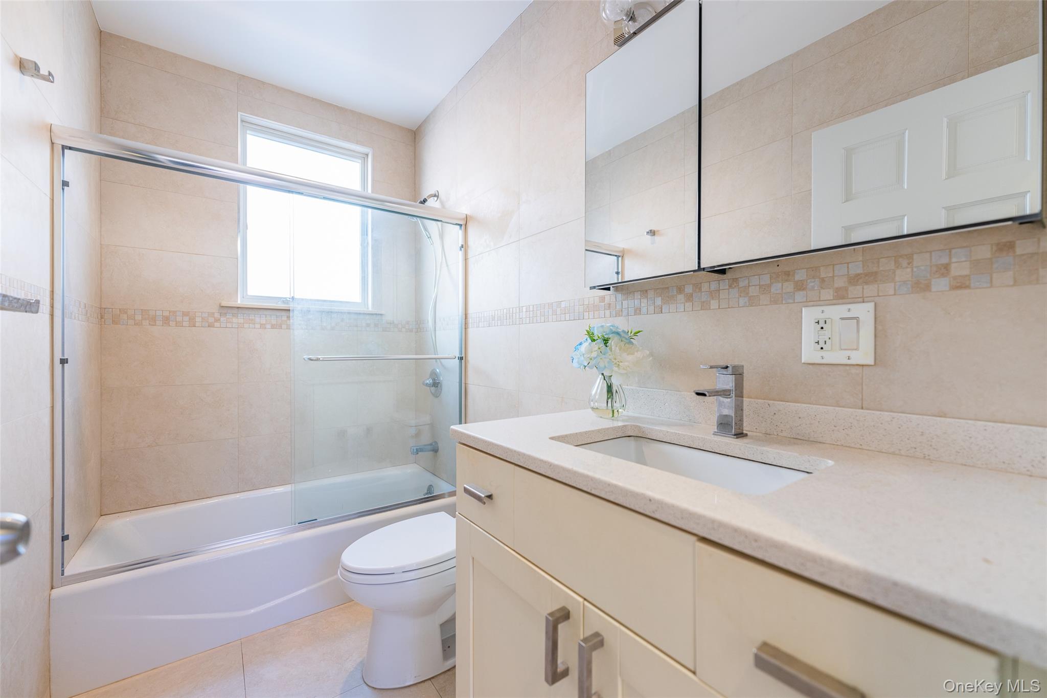 53-12 199th Street Queens, NY 11365 - Photo 18 of 31 a bathroom with a sink a toilet and shower