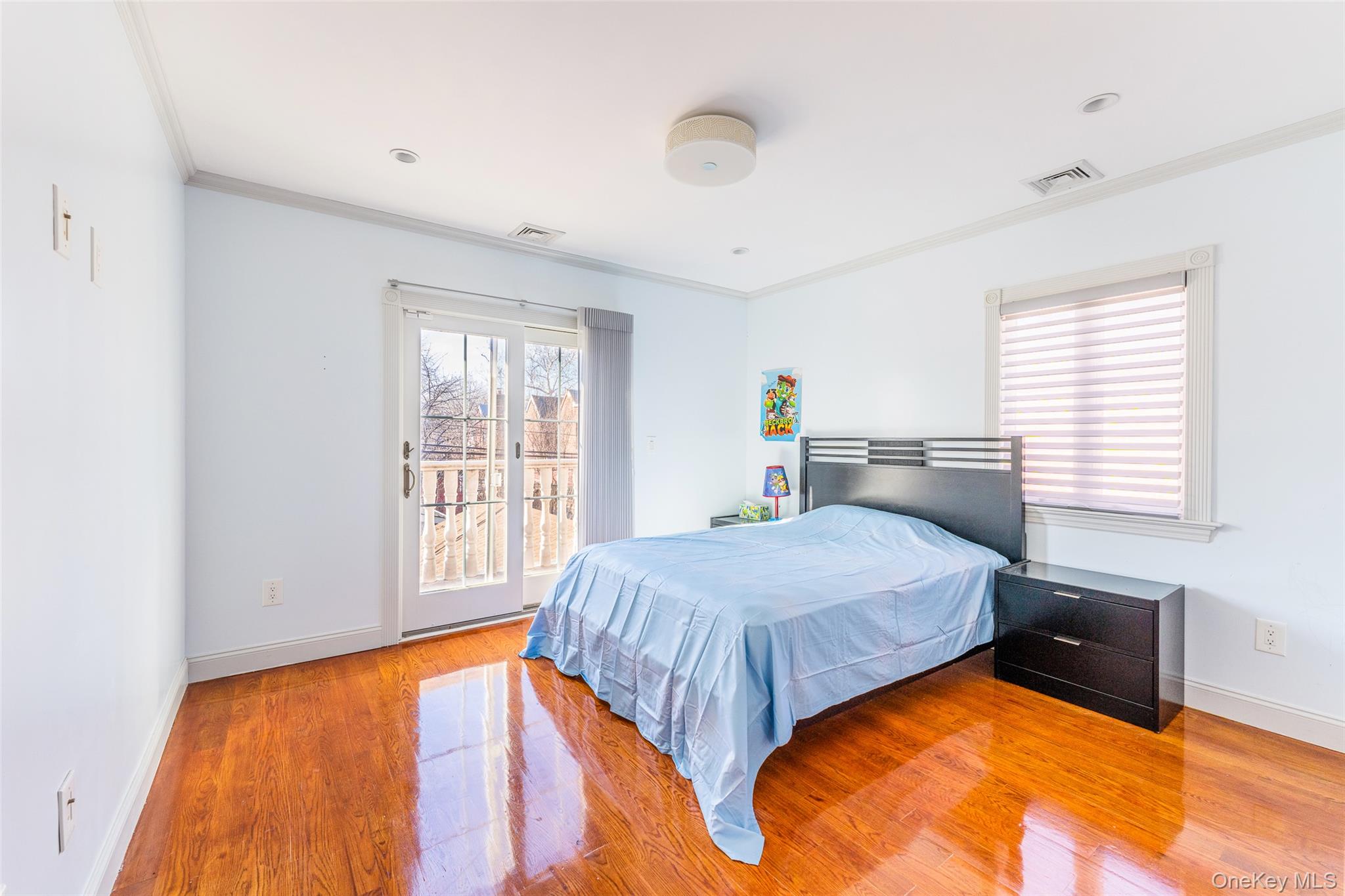 53-12 199th Street Queens, NY 11365 - Photo 19 of 31 a bedroom with a bed and window