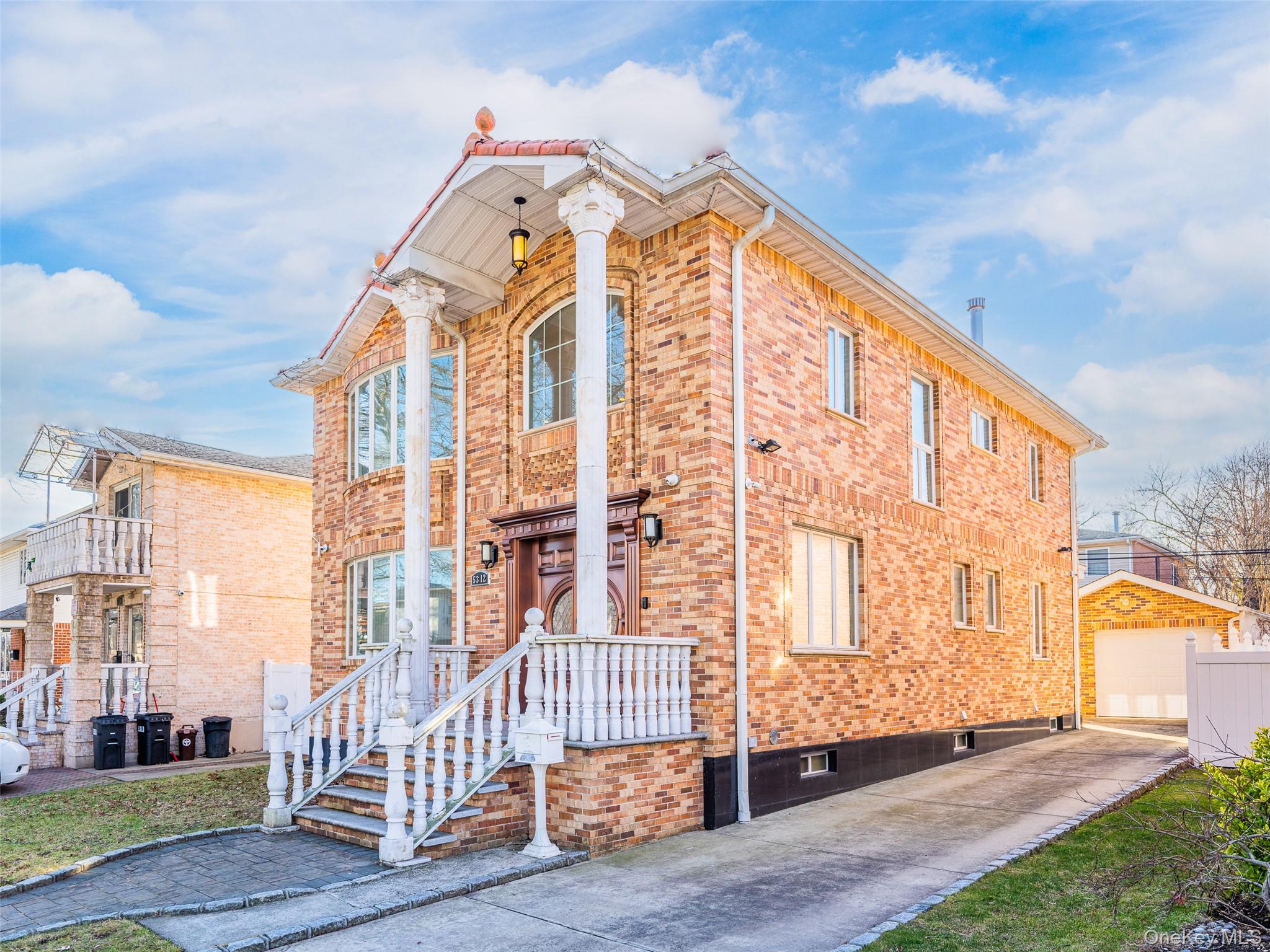 53-12 199th Street Queens, NY 11365 - Photo 2 of 31 a view of a large building with a small yard