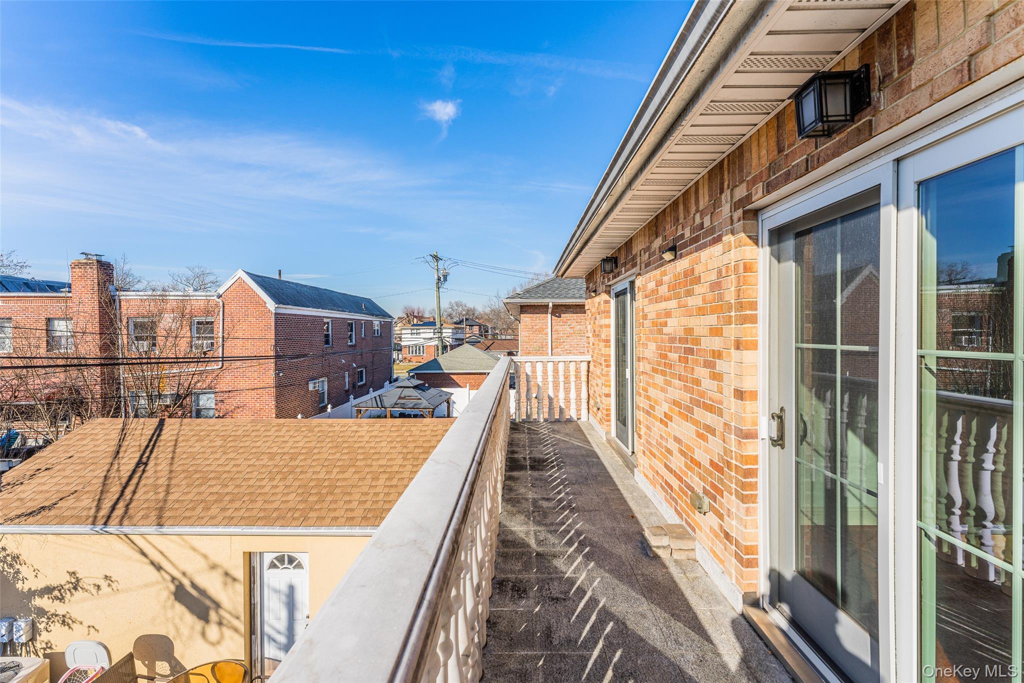 53-12 199th Street Queens, NY 11365 - Photo 25 of 31 a view of balcony with wooden floor and seating space