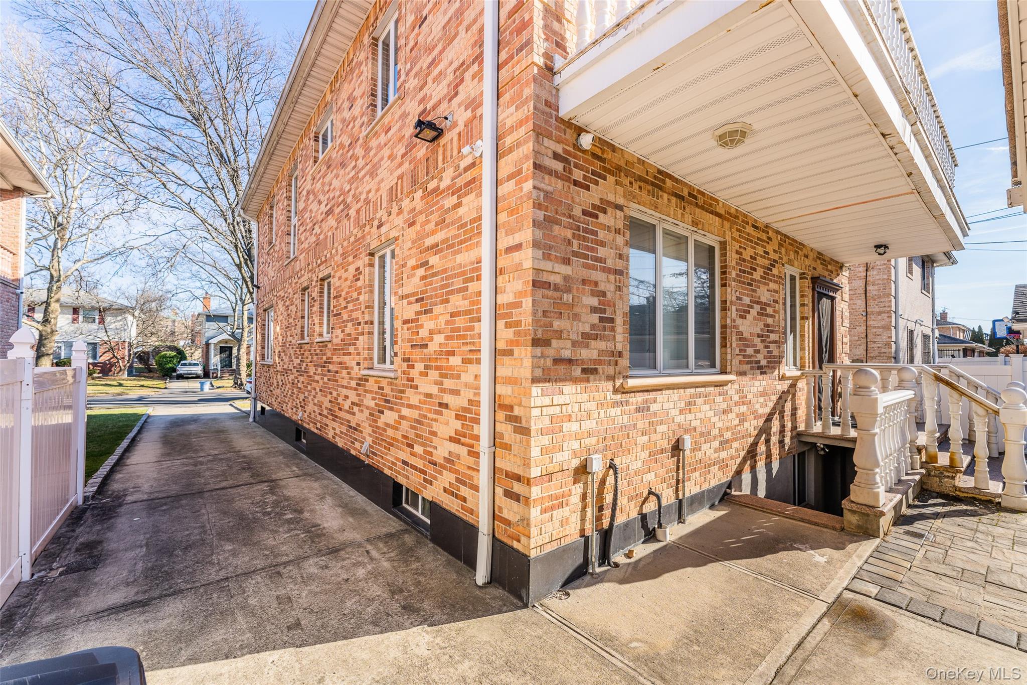 53-12 199th Street Queens, NY 11365 - Photo 26 of 31 a view of a brick house with many windows