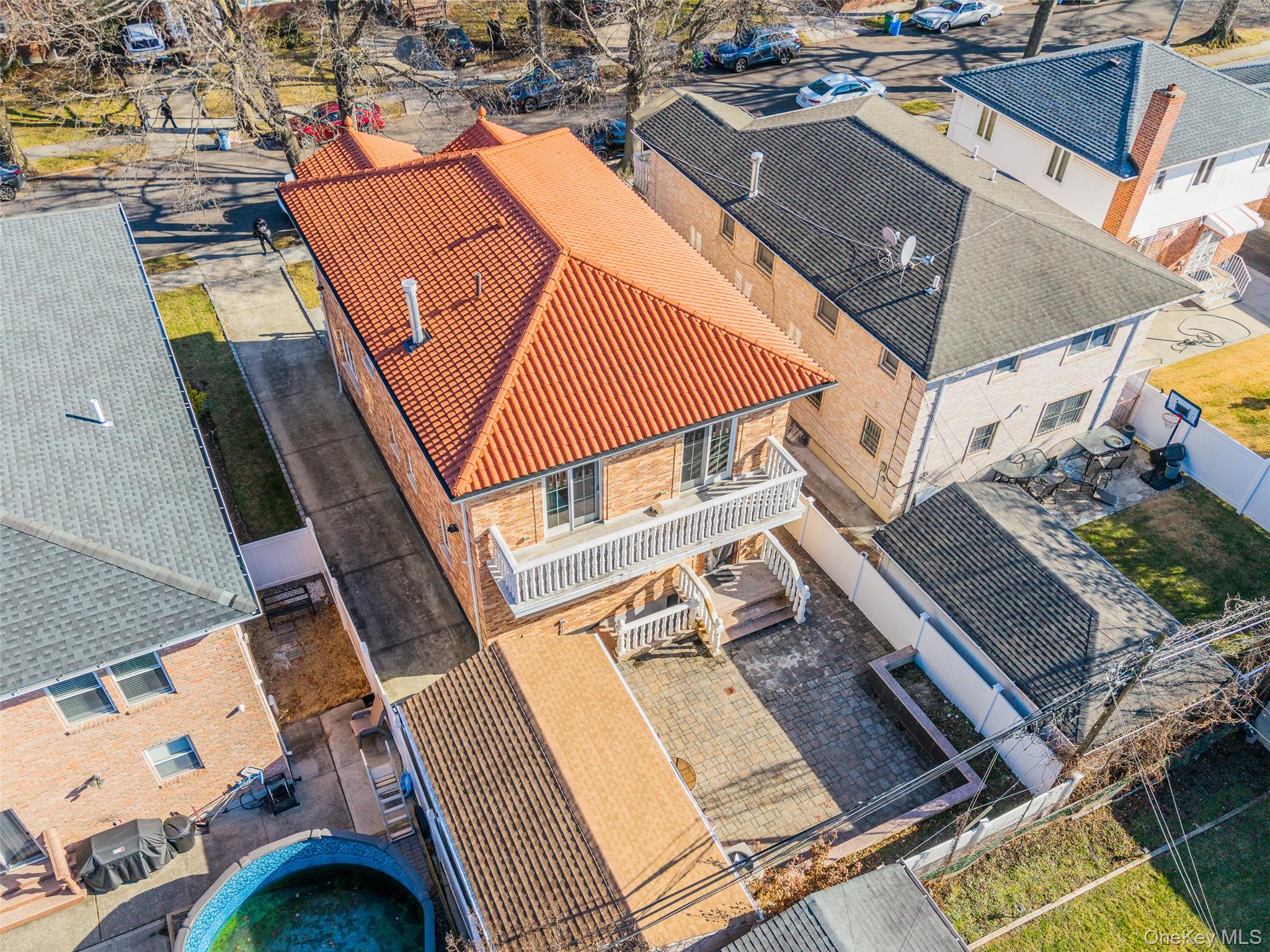 53-12 199th Street Queens, NY 11365 - Photo 28 of 31 an aerial view of a house with a swimming pool