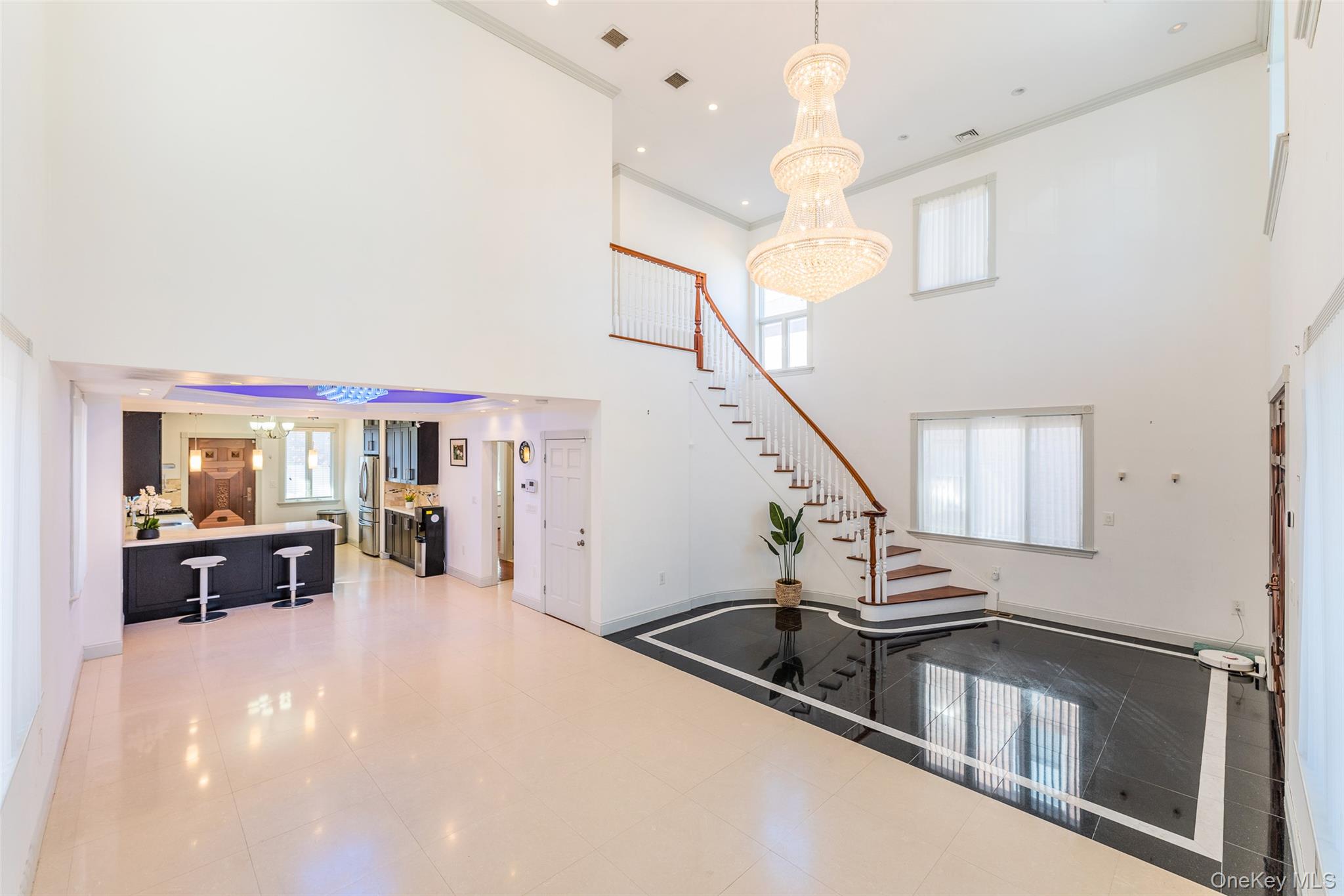 53-12 199th Street Queens, NY 11365 - Photo 7 of 31 a view of a livingroom with furniture staircase and a ceiling fan