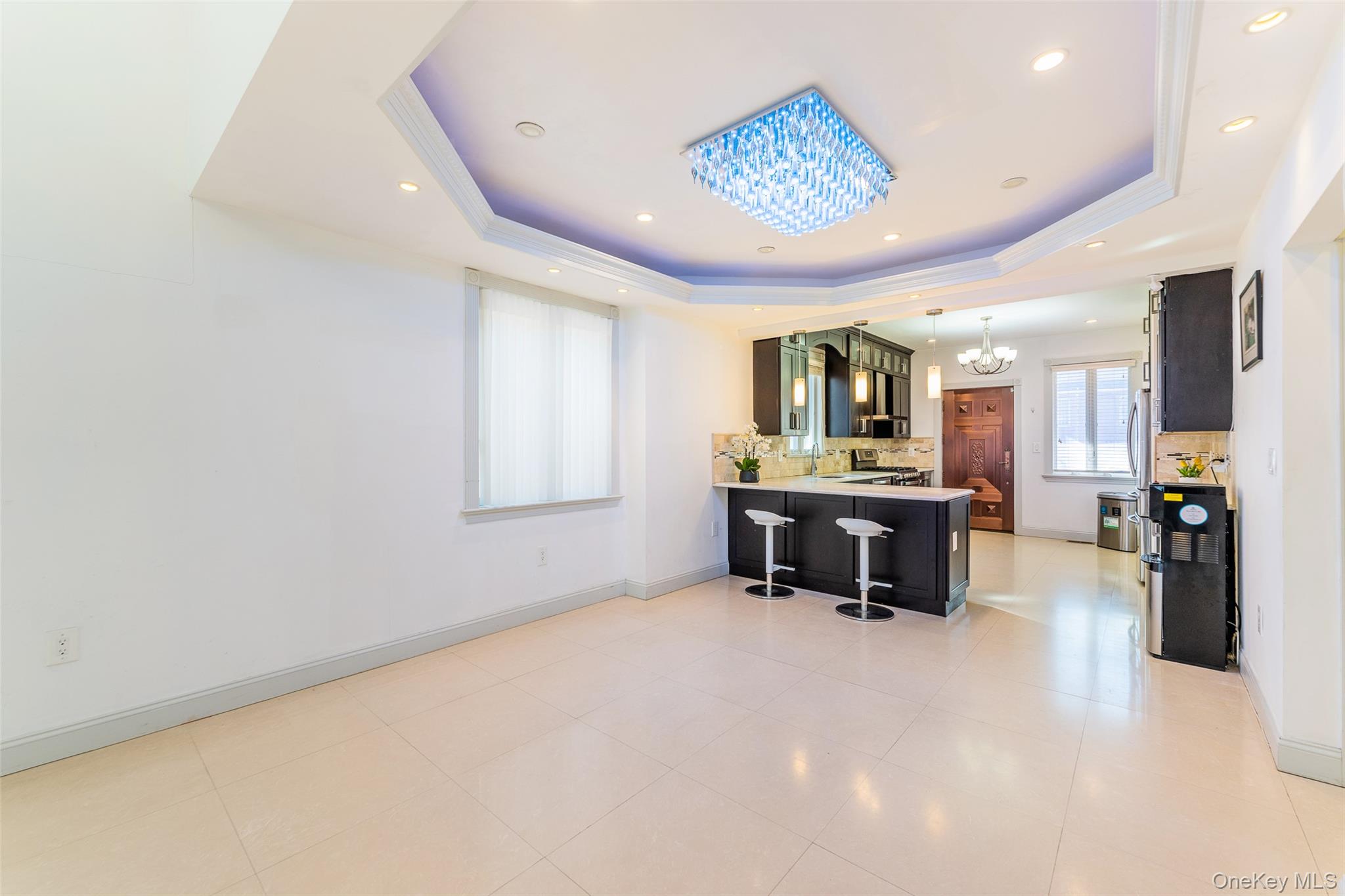 53-12 199th Street Queens, NY 11365 - Photo 9 of 31 a view of a lobby with furniture and a chandelier