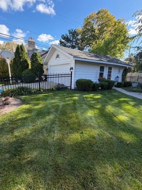 435 Elmore Street Park Ridge, IL 60068 - Photo 8 of 9 a view of a house next to a yard with big trees and plants