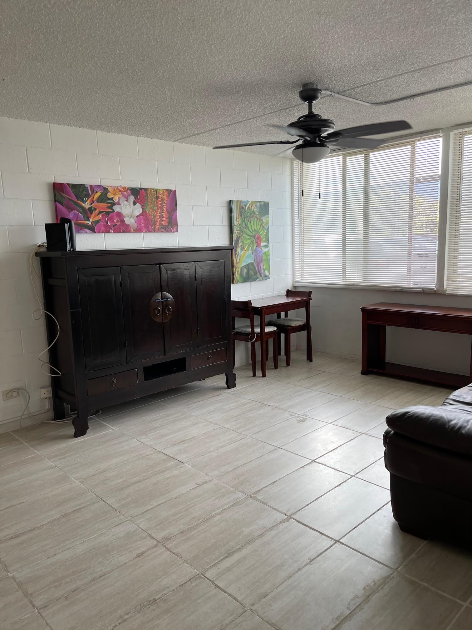 111 Kahului Beach Road, Unit D112 Kahului, HI 96732 - Photo 14 of 29 a living room with furniture a flat screen tv and a window