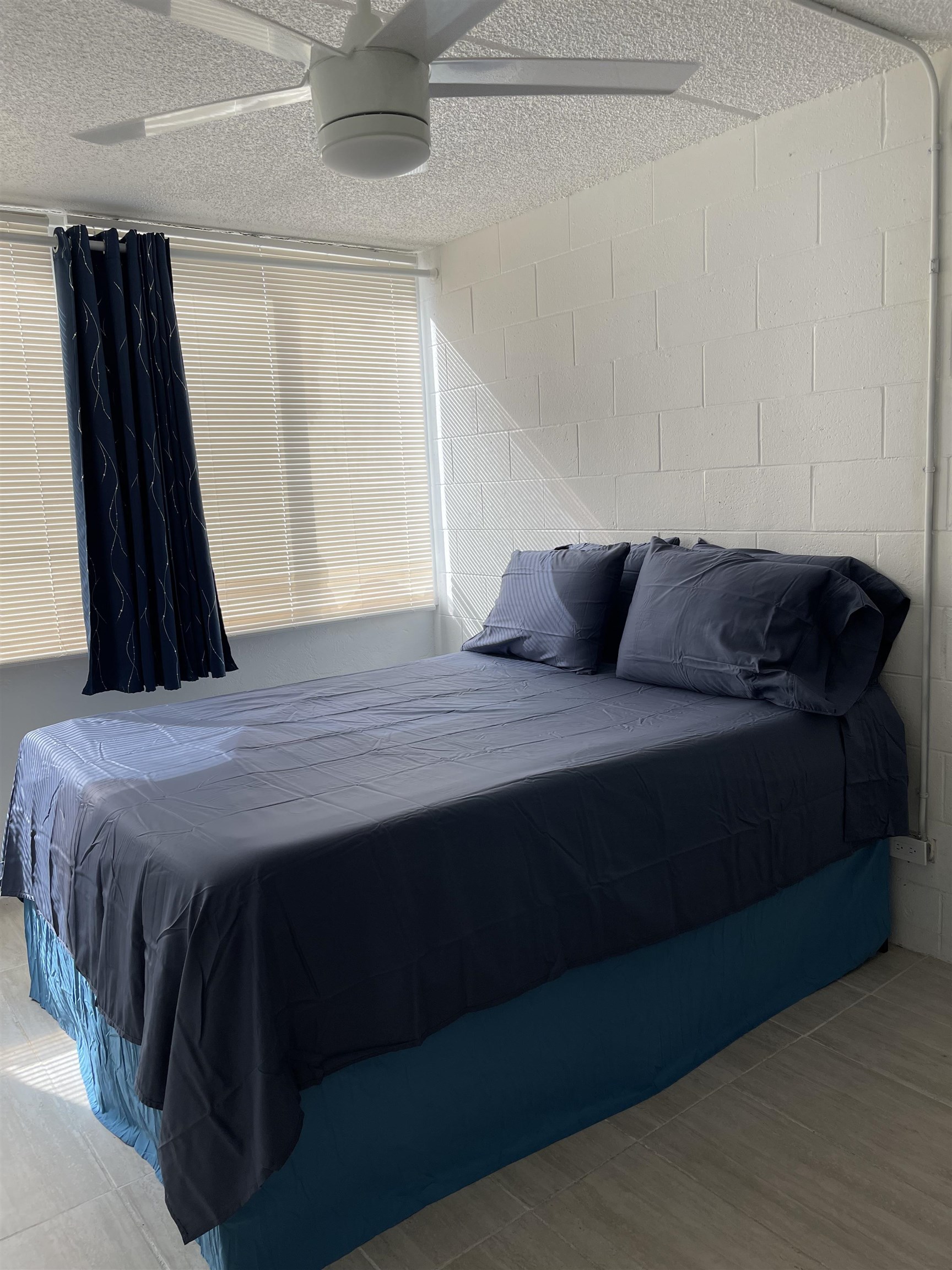 111 Kahului Beach Road, Unit D112 Kahului, HI 96732 - Photo 20 of 29 a bedroom with a bed and a dresser