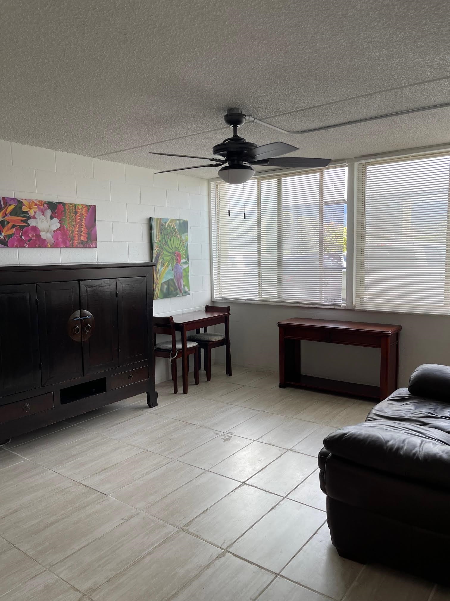 111 Kahului Beach Road, Unit D112 Kahului, HI 96732 - Photo 5 of 29 a living room with furniture and a flat screen tv