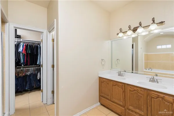 a bathroom with a double vanity sink and a