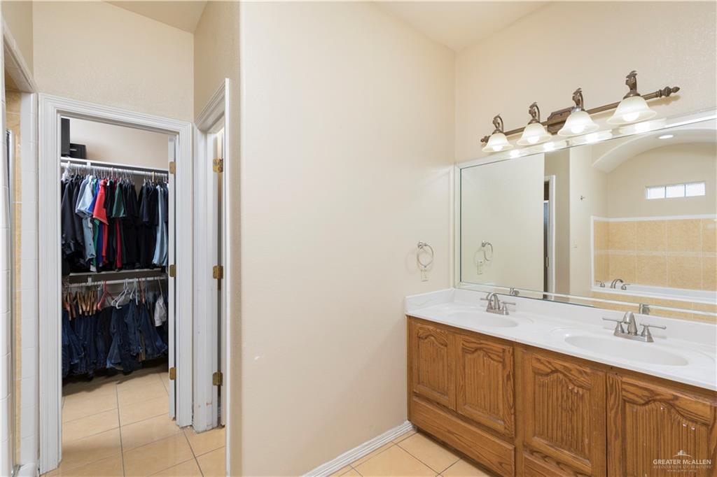 616 Gable Drive Pharr, TX 78577 - Photo 11 of 22 a bathroom with a double vanity sink and a