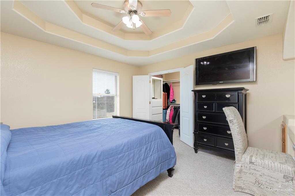 616 Gable Drive Pharr, TX 78577 - Photo 13 of 22 a bedroom with a bed and a flat screen tv