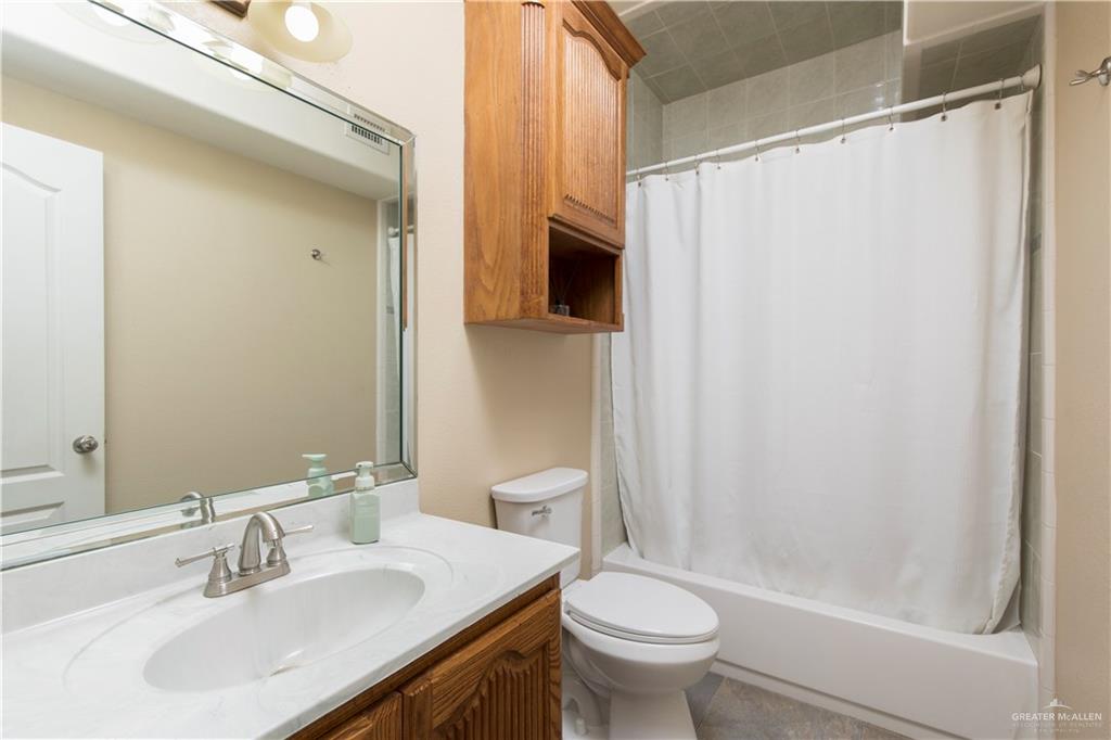 616 Gable Drive Pharr, TX 78577 - Photo 15 of 22 a bathroom with a sink a toilet and a mirror