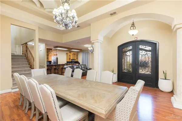 a view of a dining room with furniture and wooden floor