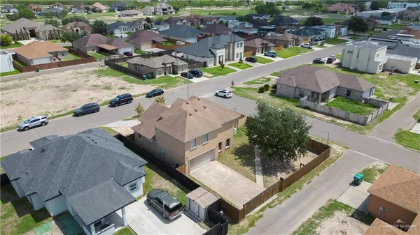 an aerial view of a house with a garden
