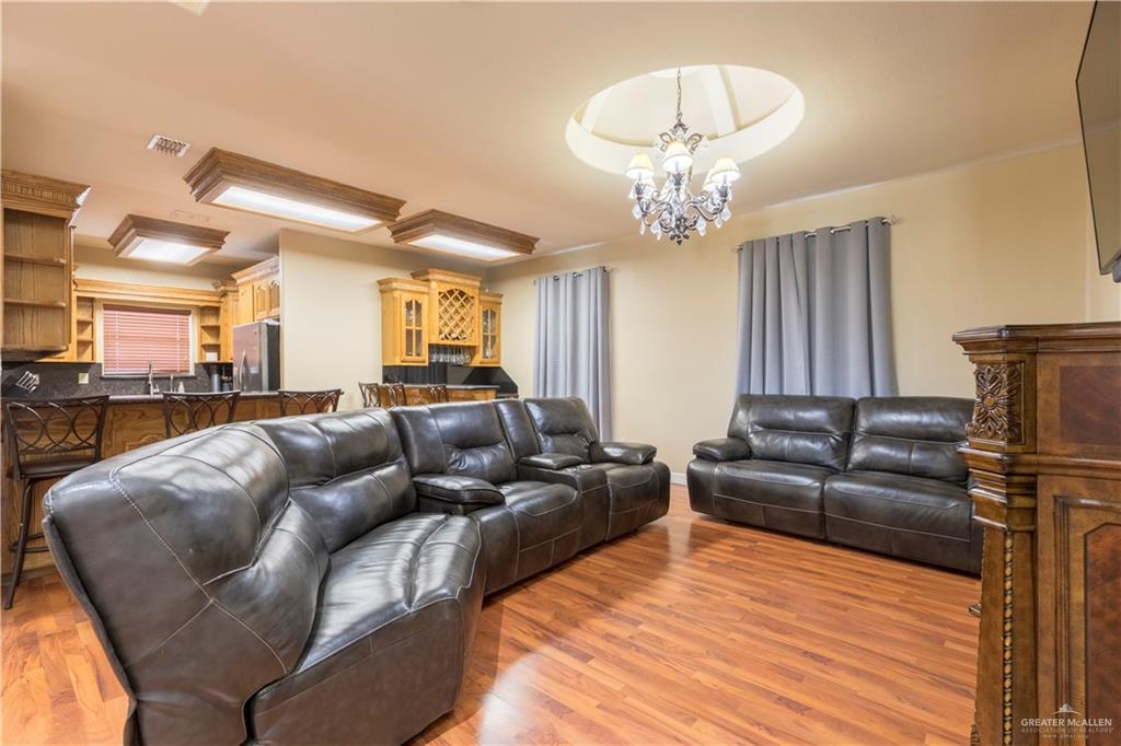 616 Gable Drive Pharr, TX 78577 - Photo 7 of 22 a living room with furniture and a chandelier