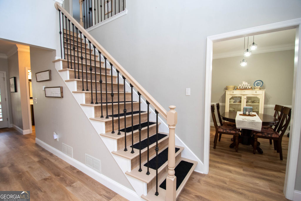 100 Spring Forest Trail Sharpsburg, GA 30277 - Photo 14 of 39 a view of entryway and hall with wooden floor