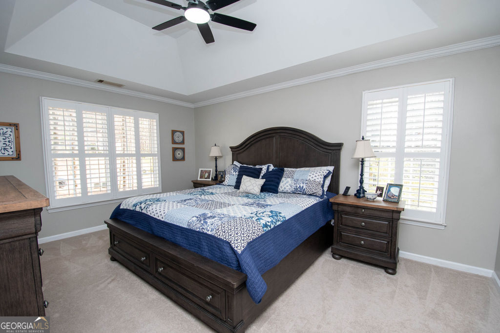 100 Spring Forest Trail Sharpsburg, GA 30277 - Photo 16 of 39 a bedroom with a bed and a window