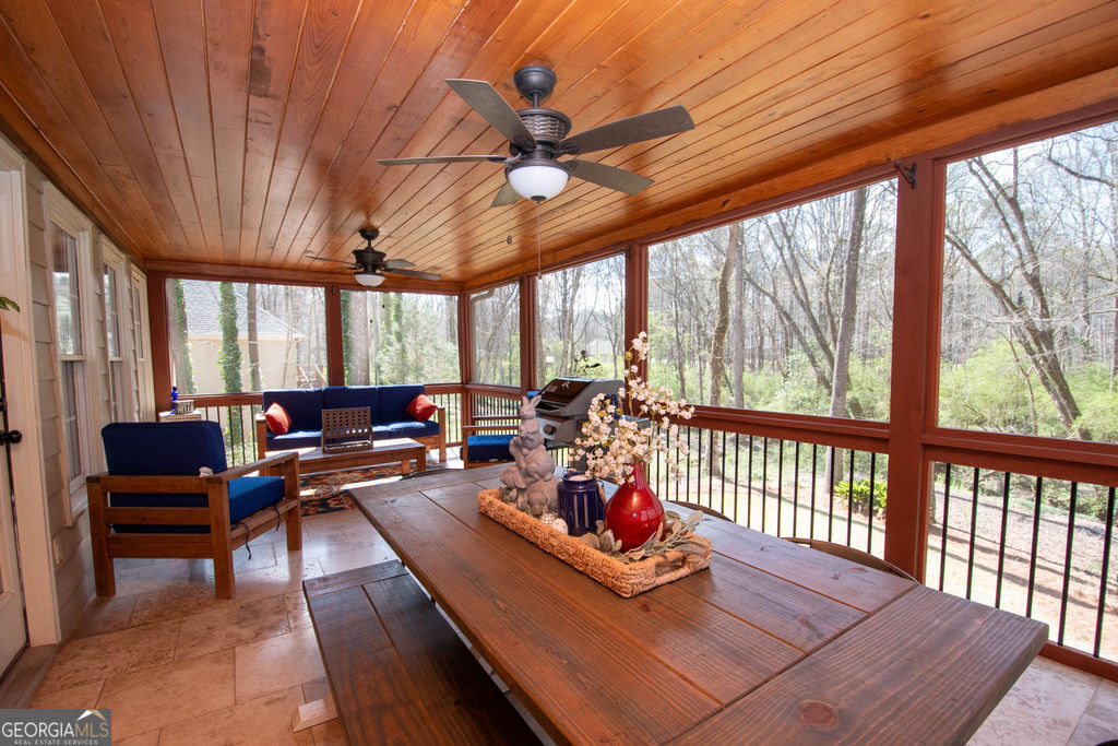 100 Spring Forest Trail Sharpsburg, GA 30277 - Photo 28 of 39 a living room with furniture next to a large window