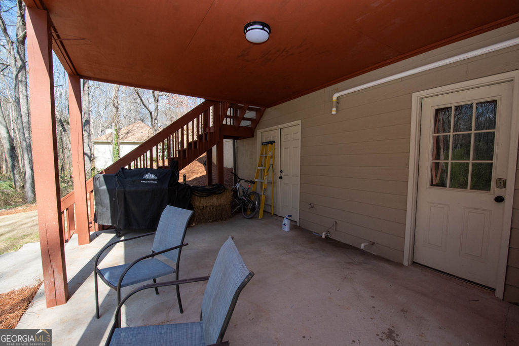 100 Spring Forest Trail Sharpsburg, GA 30277 - Photo 32 of 39 a view of an chairs and table in the balcony