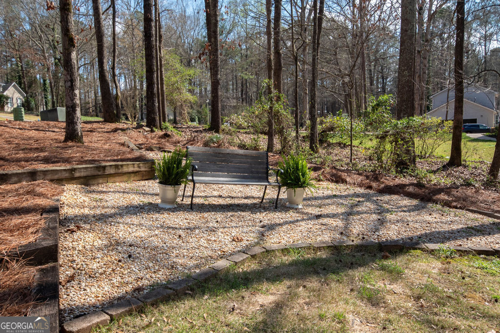 100 Spring Forest Trail Sharpsburg, GA 30277 - Photo 33 of 39 a view of a yard with swimming pool and sitting area