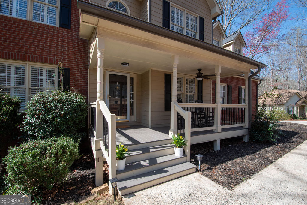 100 Spring Forest Trail Sharpsburg, GA 30277 - Photo 4 of 39 a view of a chair and table in the patio