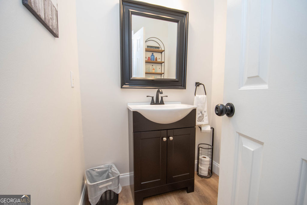 100 Spring Forest Trail Sharpsburg, GA 30277 - Photo 8 of 39 a bathroom with a sink and a mirror