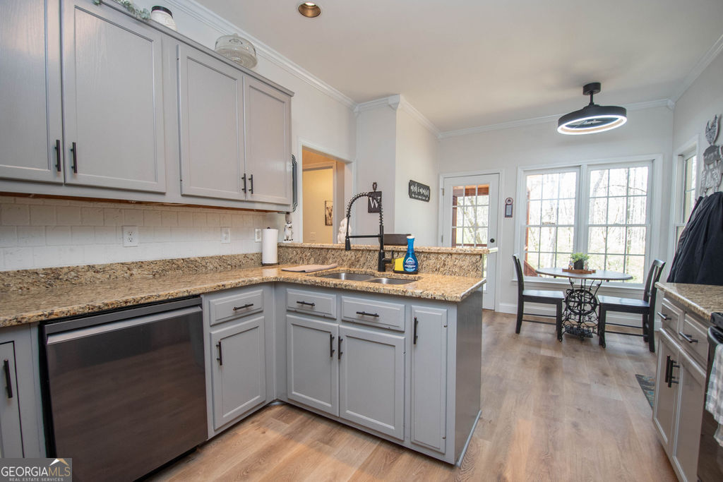 100 Spring Forest Trail Sharpsburg, GA 30277 - Photo 9 of 39 a kitchen with cabinets appliances and a sink