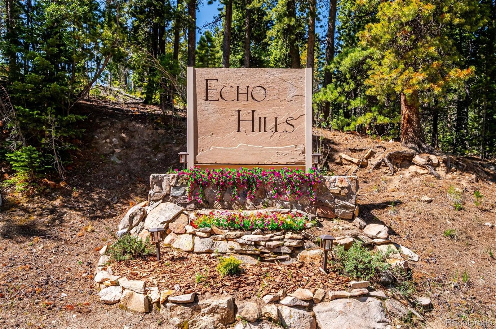 1633 Sinton Road Evergreen, CO 80439 - Photo 8 of 50 a sign on the side of the road