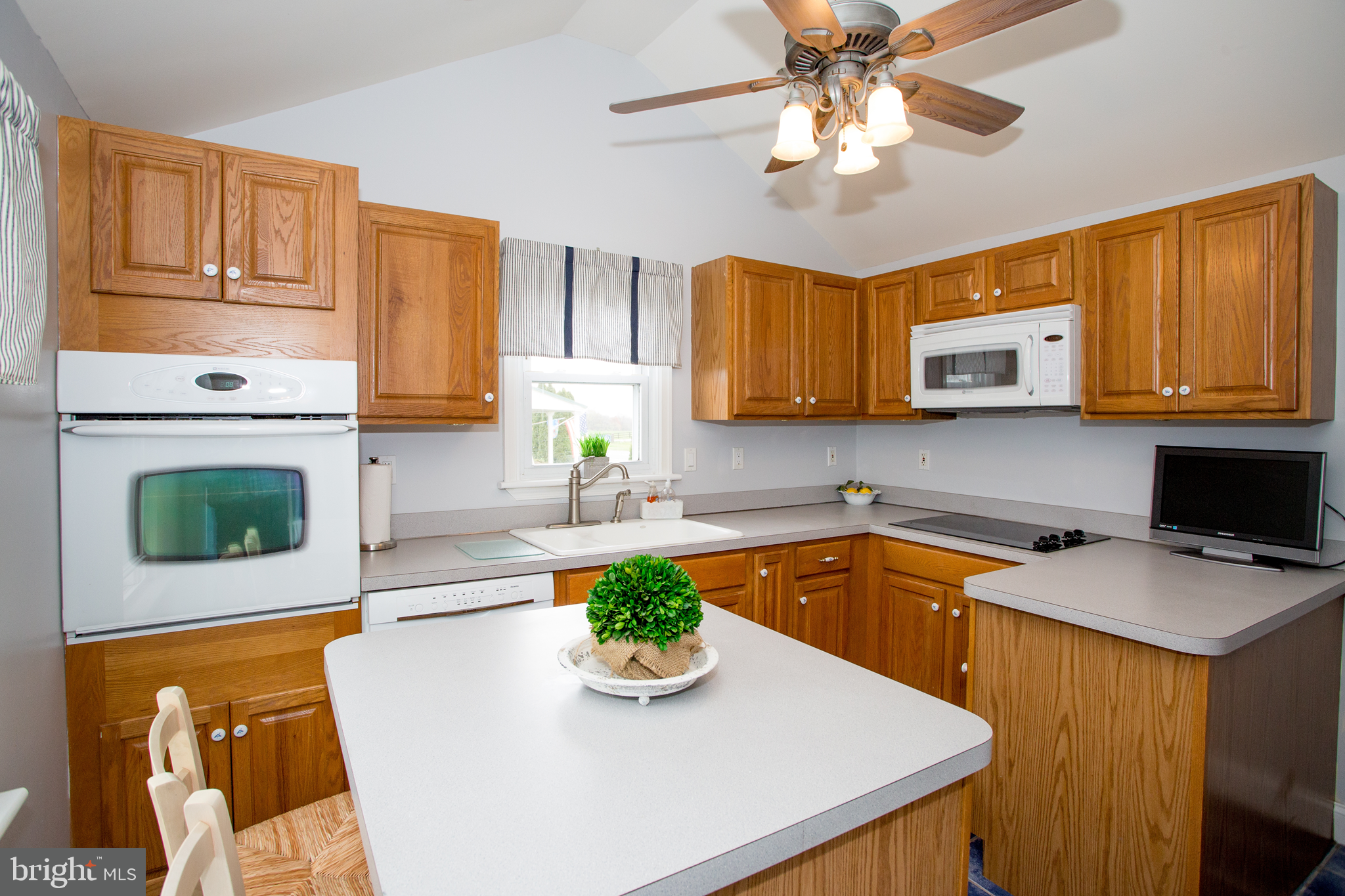 5885 Telegraph Road Elkton, MD 21921 - Photo 13 of 27 a kitchen with a stove a sink and a microwave