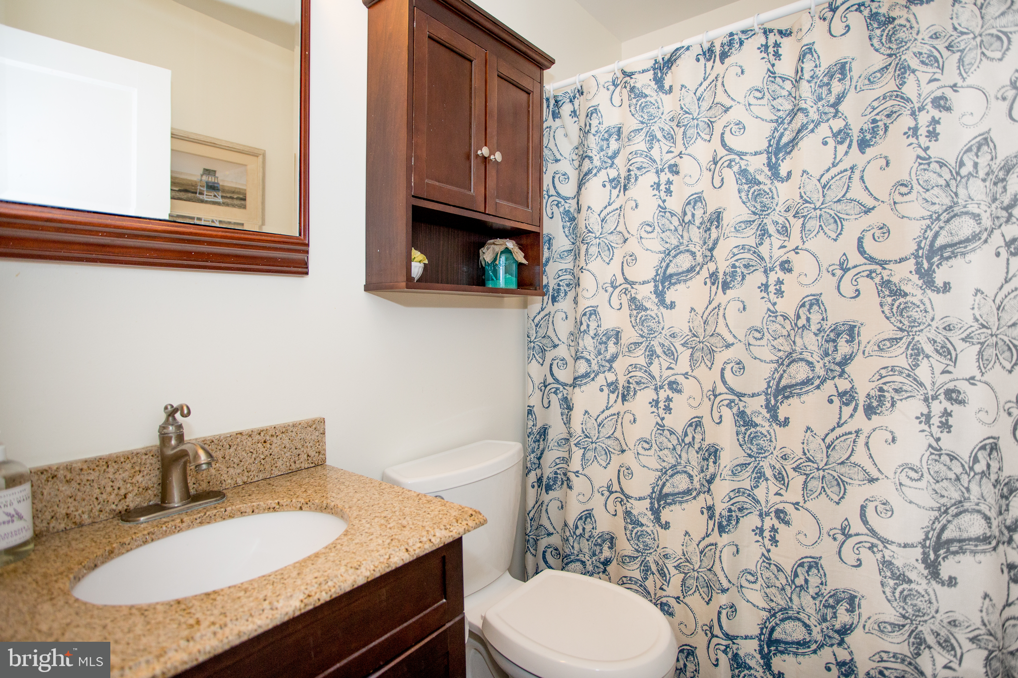 5885 Telegraph Road Elkton, MD 21921 - Photo 23 of 27 a bathroom with a granite countertop sink and a mirror