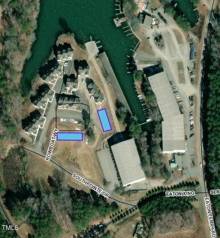 an aerial view of residential house with outdoor space and parking