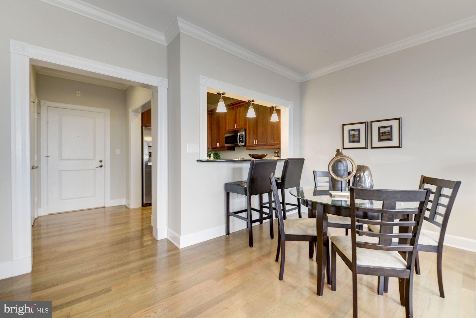 401 13th Street Northeast, Unit PH8 Washington, DC 20002 - Photo 11 of 27 a view of a dining room with furniture and wooden floor