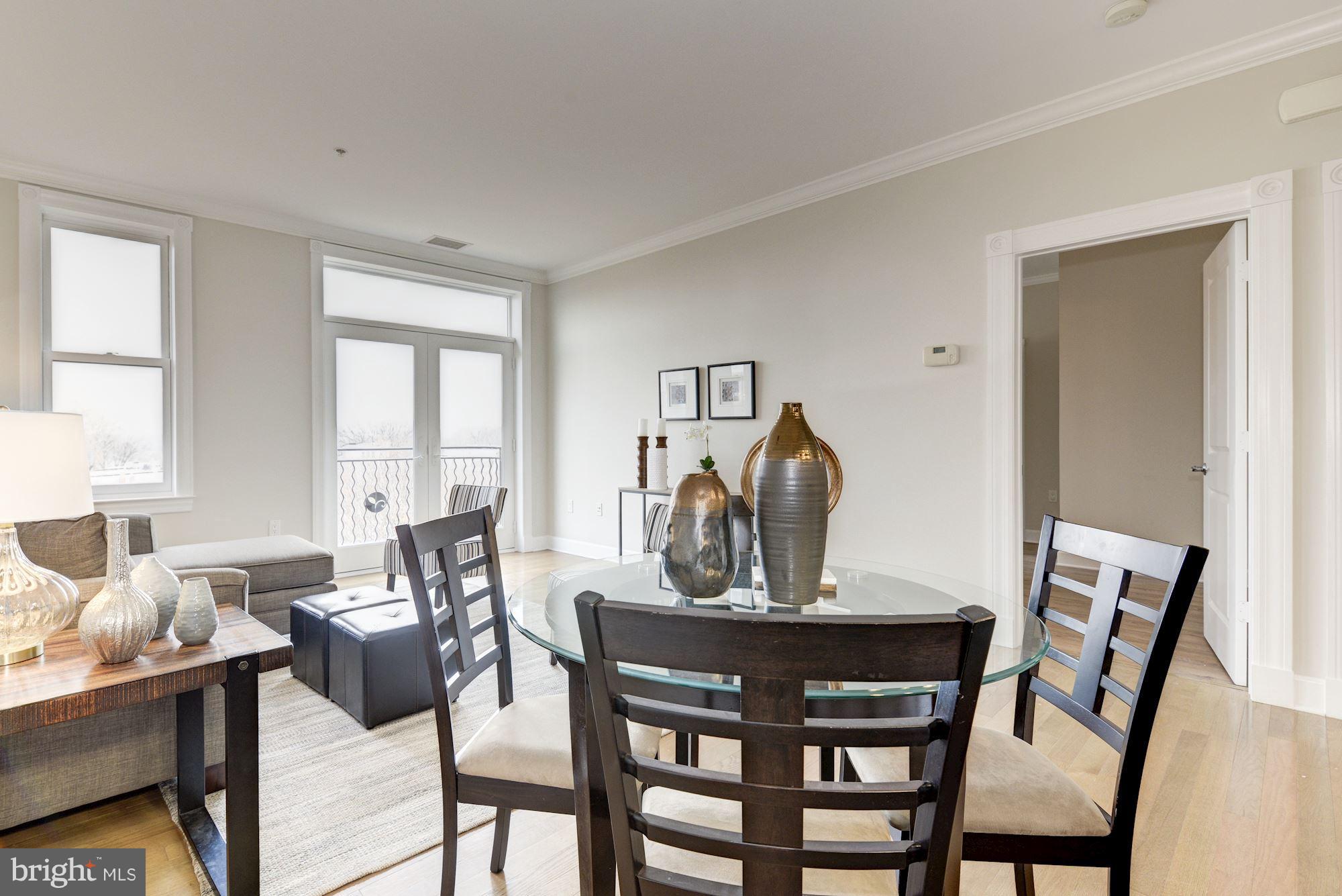401 13th Street Northeast, Unit PH8 Washington, DC 20002 - Photo 12 of 27 a view of a dining room with furniture and window