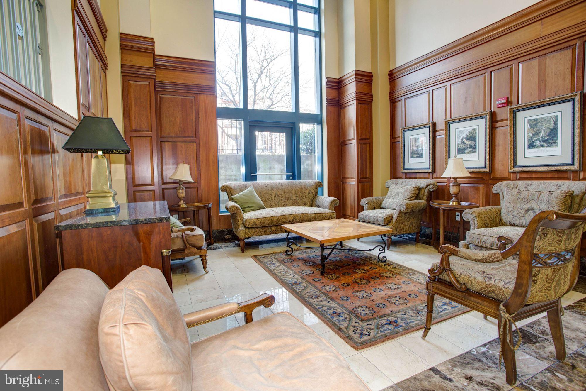 401 13th Street Northeast, Unit PH8 Washington, DC 20002 - Photo 25 of 27 a living room with furniture and a large window