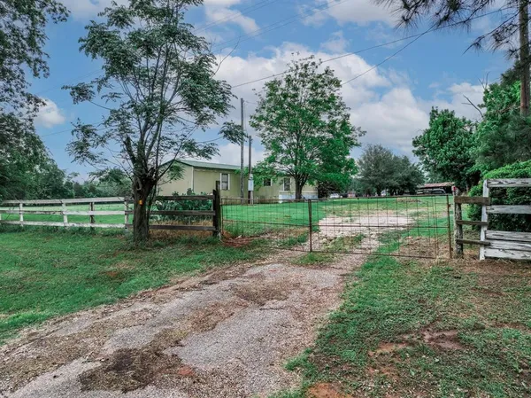 a view of a garden with houses