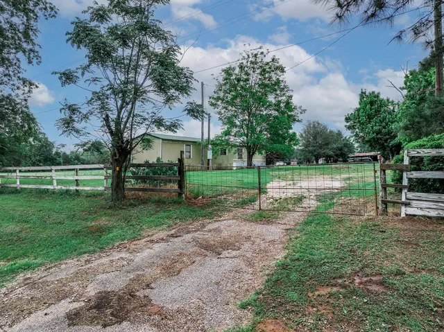 a view of a garden with houses
