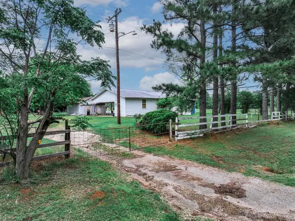a view of a garden with an outdoor space