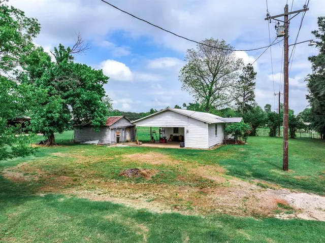 a backyard of a house with lots of green space