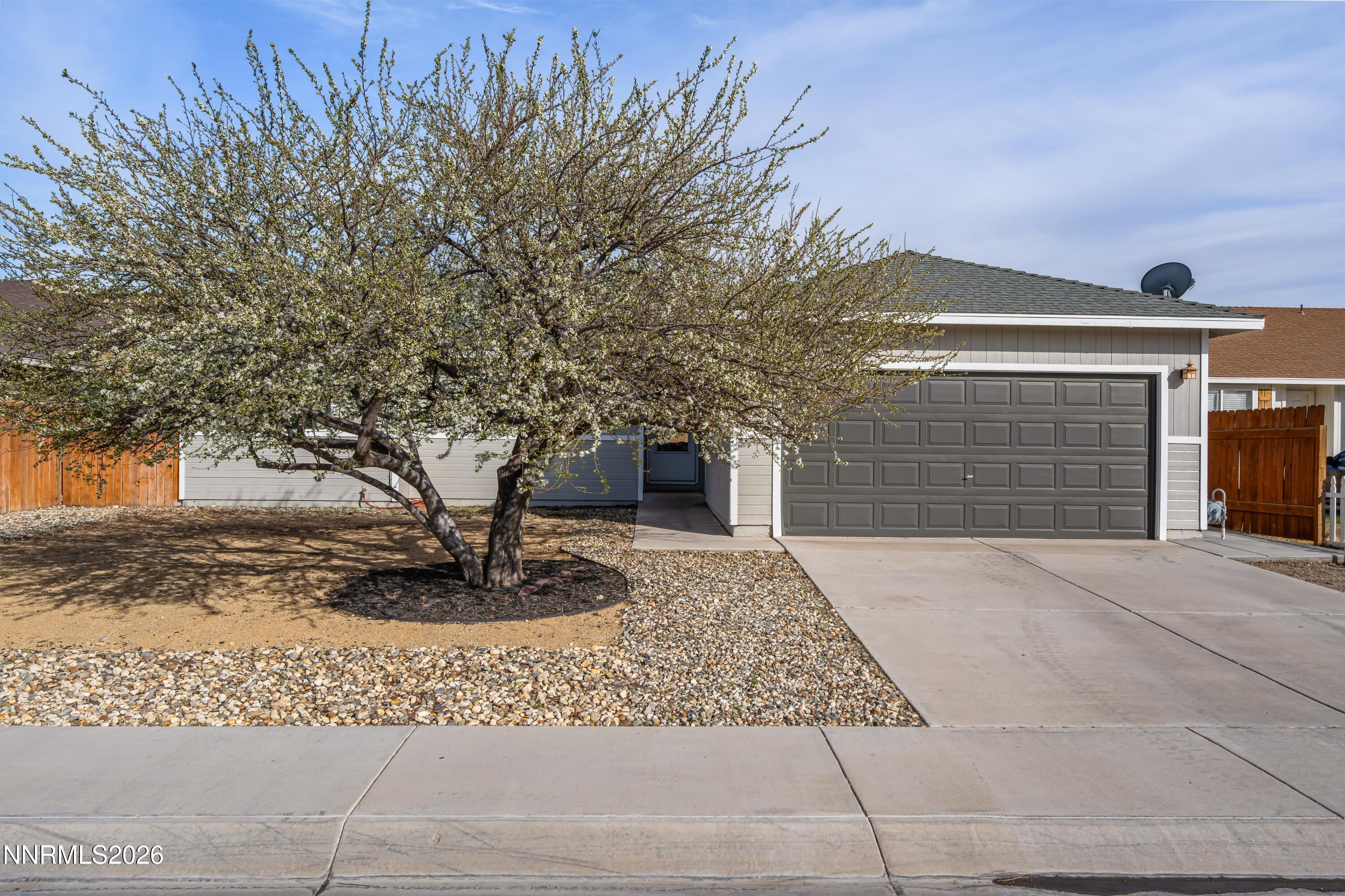 712 Hastings Way Fernley, NV 89408 - Photo 1 of 36 a front view of a house with a yard