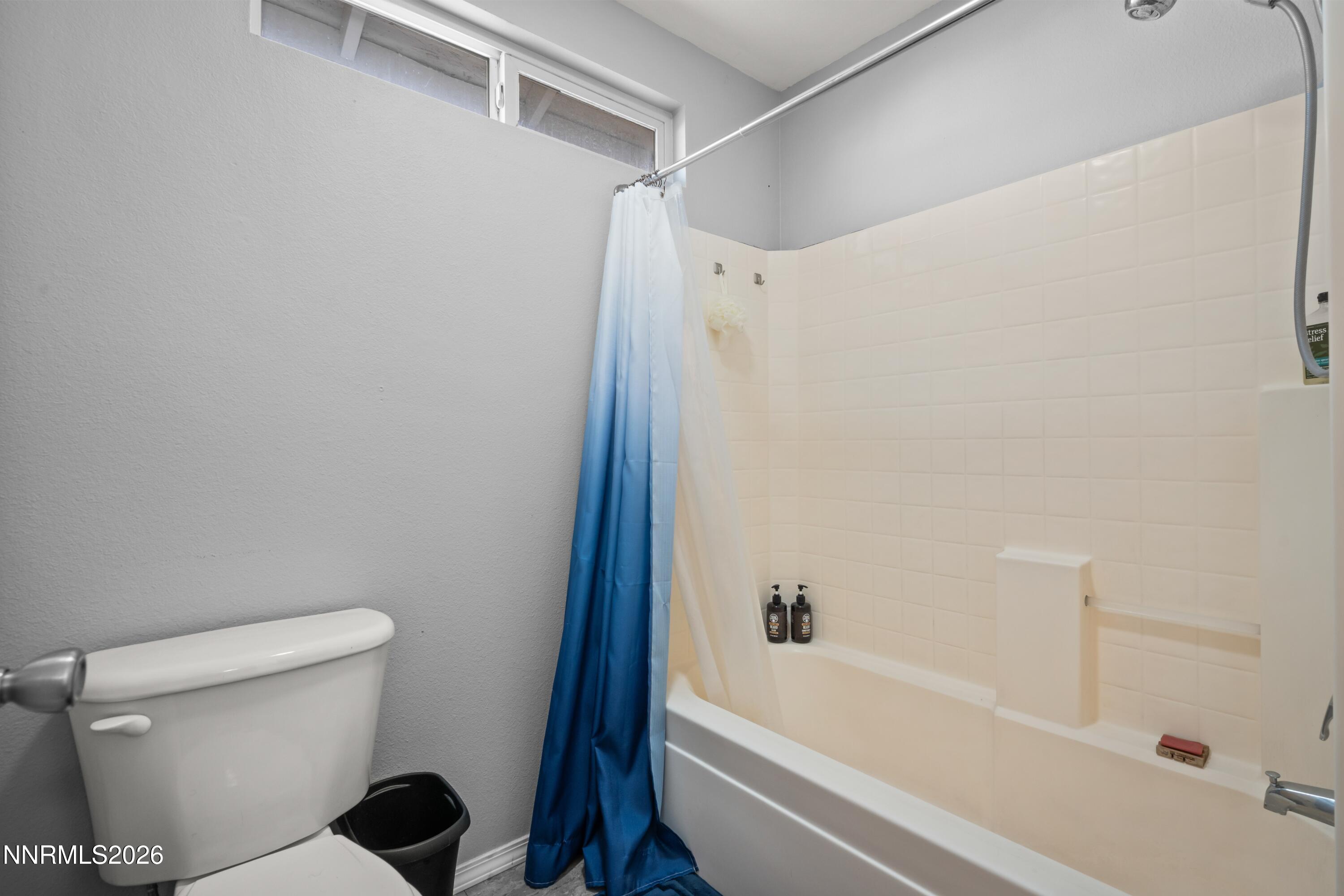 712 Hastings Way Fernley, NV 89408 - Photo 12 of 36 a bathroom with a shower and a toilet