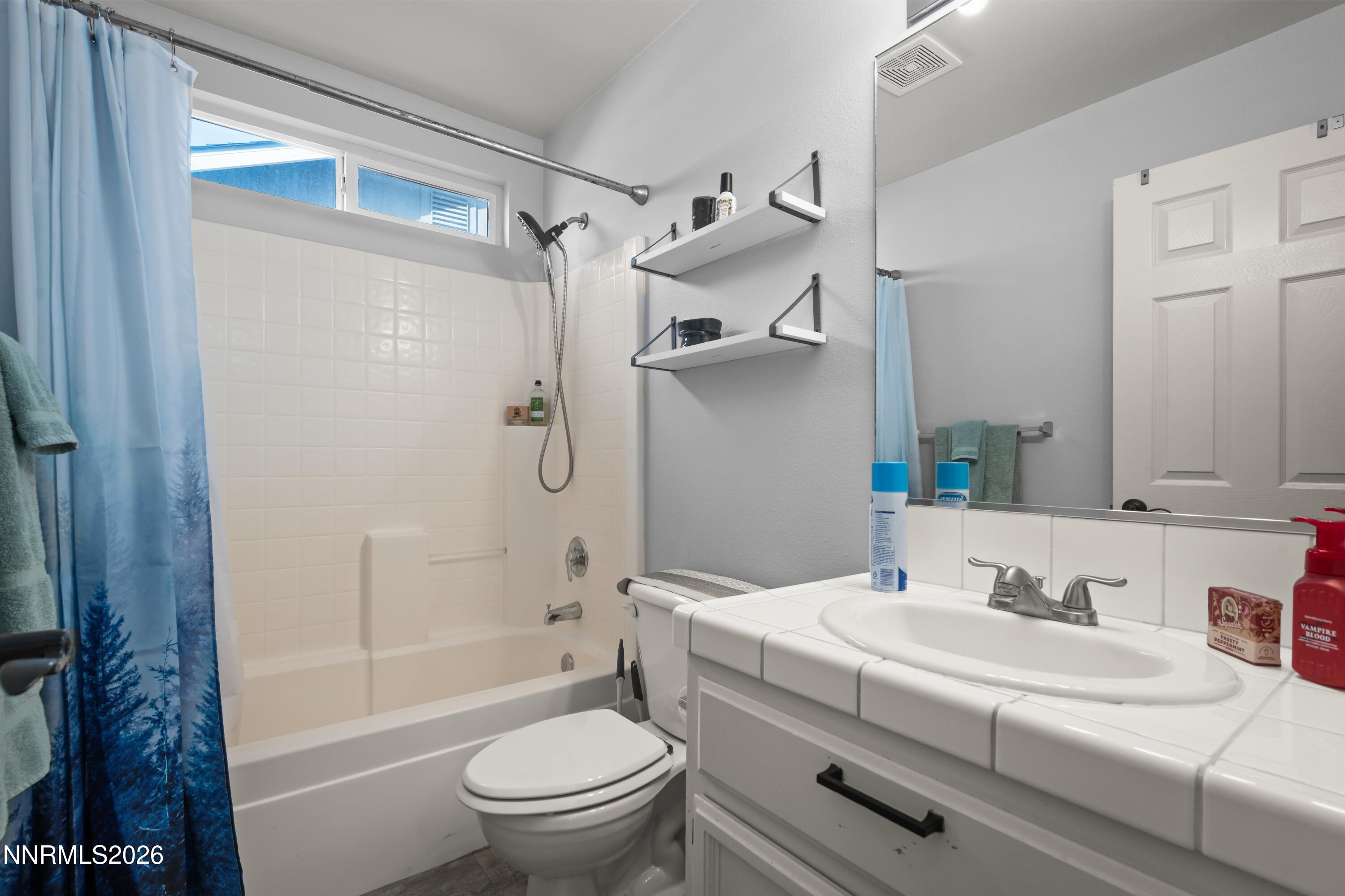 712 Hastings Way Fernley, NV 89408 - Photo 15 of 36 a bathroom with a sink toilet and shower
