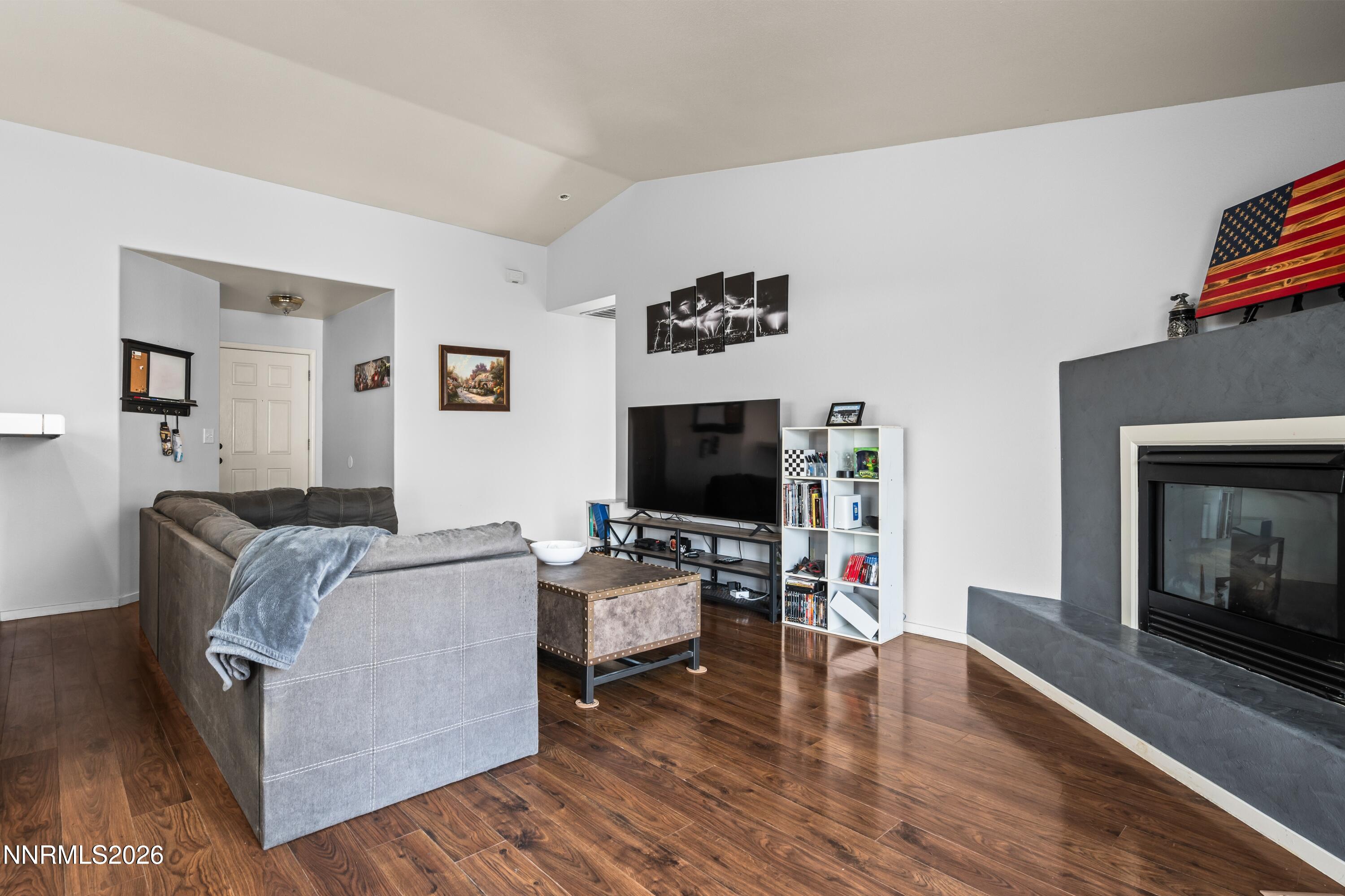 712 Hastings Way Fernley, NV 89408 - Photo 16 of 36 a living room with furniture and a flat screen tv